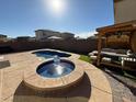 Backyard pool area featuring an inviting hot tub and ample outdoor space at 2857 Victorian Rd, North Las Vegas, NV 89086