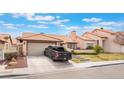Inviting single-story home with a well-manicured lawn, neutral paint, and convenient attached garage at 3901 W Red Coach Ave, North Las Vegas, NV 89031