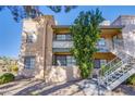 Traditional apartment exterior with outdoor stairway and mature landscaping at 5174 S Jones Blvd # 101, Las Vegas, NV 89118