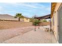 Backyard featuring a brick patio with furniture, a gravel area, and a block wall at 6278 Heather Creek Pl, Las Vegas, NV 89122