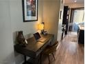 A cozy, modern office space next to the kitchen features natural light and plenty of work space at 742 Agave Falls St, Henderson, NV 89011
