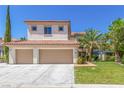 Charming two-story home with a well-manicured lawn, lush trees, and a spacious two-car garage at 7808 Foothill Ash Ave, Las Vegas, NV 89117