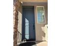 Stylish front door framed by brick accents, offering a warm and inviting entrance at 8113 Mineola Palms St, Las Vegas, NV 89139