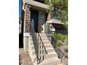 Close up of the front entrance, featuring a stylish front door and brick accents at 8113 Mineola Palms St, Las Vegas, NV 89139
