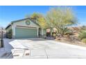 Charming single-story home with a two-car garage and low maintenance desert landscaping at 8337 Willow Basin Ct, Las Vegas, NV 89131