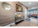 Inviting foyer with wood-look accent wall, modern console table, and an open view to the living area at 1000 E Enchanted Mesa St, Pahrump, NV 89048