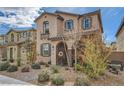 Two-story house featuring a cute balcony, decorative shutters, and desert landscaping at 1111 Frye Mesa Ave, North Las Vegas, NV 89086