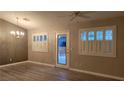 Bright living room features fresh paint, modern light fixture, and attractive plantation shutters at 1147 Light Sky Ave, Henderson, NV 89074