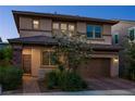 Charming two-story home featuring a well-maintained front yard, a two car garage, and inviting curb appeal at 3034 Scenic Rhyme Ave, Henderson, NV 89044