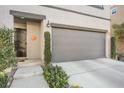 Close up of charming two-story home featuring a well-manicured front yard and a two-car garage at 3681 Via Sonja Ave, Las Vegas, NV 89115