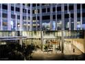 Modern building entrance with glass facade and manicured greenery at Waldorf Astoria Residences at 3750 Las Vegas Blvd # 2408, Las Vegas, NV 89158