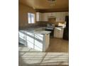 Bright kitchen featuring white cabinets and granite countertops at 4012 Mira Ln, Las Vegas, NV 89108