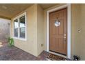 Cozy front porch with a 'Welcome Home' sign, adding a personal touch at 408 Gracious Way, Henderson, NV 89011