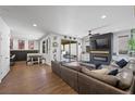 Open-concept living room with modern fireplace and sliding glass doors to the backyard at 408 Gracious Way, Henderson, NV 89011