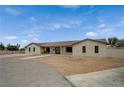 An alternative view of the single story home featuring an oversized drive at 4625 W Robindale Rd, Las Vegas, NV 89139