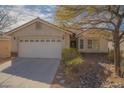 Charming single-story home with stone accents, drought-resistant landscaping, and a two-car garage at 5989 Sierra Medina Ave, Las Vegas, NV 89139