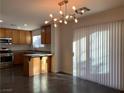 Charming kitchen and dining area featuring stainless steel appliances and an island at 6425 W Haleh Ave, Las Vegas, NV 89141