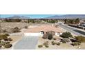 Expansive aerial view of a beautiful single-story home with desert landscaping and scenic mountain views at 720 Florida St, Pahrump, NV 89048