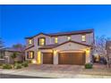 Charming two-story house with a three-car garage, picturesque landscaping, and a welcoming entrance at 7411 Zonal Ave, Las Vegas, NV 89131