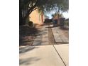 Paver driveway alongside the home, offering additional parking, and access to the backyard at 8494 Langhorne Creek St, Las Vegas, NV 89139