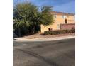 Two-story home with a brick accent wall and mature landscaping in a residential neighborhood at 8494 Langhorne Creek St, Las Vegas, NV 89139