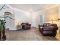 Inviting living room with neutral paint, tile flooring and comfortable brown leather furnishings at 9000 Las Vegas Blvd # 1029, Las Vegas, NV 89123