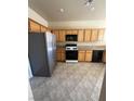 Functional kitchen with ample cabinet space and stainless-steel refrigerator at 1123 Scenic Crest Dr, Henderson, NV 89052