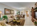 Bright living room featuring tile floors, neutral walls, and ample natural light at 1811 Tiger Creek Ave, Henderson, NV 89012