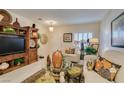 Cozy living room with tile flooring, natural lighting, and plush seating at 1811 Tiger Creek Ave, Henderson, NV 89012