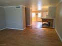 Bright living room with wood flooring and a cozy fireplace at 2223 Rugged Mesa Dr, Laughlin, NV 89029