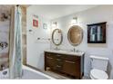 Bathroom showcasing double vanity, framed mirrors, tub and updated fixtures at 3712 Royal Crest St # 14, Las Vegas, NV 89119