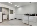 Bright laundry room featuring multiple washers and dryers for resident's use at 3712 Royal Crest St # 14, Las Vegas, NV 89119