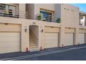 Condominium exterior featuring multiple garages, stairwell and balcony at 3883 Desert Marina Dr # 245, Laughlin, NV 89029