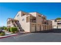 Multiple condominium units with garages, stairwells, balconies and desert landscaping at 3883 Desert Marina Dr # 245, Laughlin, NV 89029