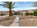 Charming home with desert landscaping, stone accents, and a concrete walkway at 4557 Bersaglio St, Las Vegas, NV 89135