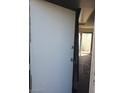 Condo entrance with solid door open revealing the interior with view of patio at 4770 Topaz St # 79, Las Vegas, NV 89121