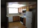 Well-lit kitchen featuring a stainless steel sink and standard appliances at 574 Roxella Ln # C, Las Vegas, NV 89110