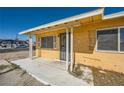 Covered front porch with security door and supports at 6120 Cairo Cir, Las Vegas, NV 89107