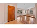 Bright and airy open-concept living room with hardwood floors and arched windows at 6217 Sadler Dr, Las Vegas, NV 89130