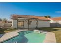 An inviting private pool offers a refreshing escape in this lovely backyard with an outdoor covered patio at 764 Biaritz Ave, Las Vegas, NV 89123