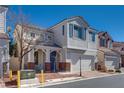 Inviting home with a cozy porch, lush greenery, and a two-car garage at 7978 Light Tower St, Las Vegas, NV 89139