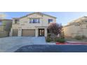 Inviting two-story home with well-manicured landscaping, and a convenient three-car garage at 8223 Saddleback Ledge Ave, Las Vegas, NV 89147