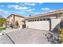 Attached two car garage and paved driveway at 8520 Copper Falls Ave, Las Vegas, NV 89129