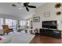 Open-concept living room with hardwood floors and large windows at 8808 Litchfield Ave, Las Vegas, NV 89134