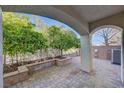 Paver patio under a covered patio with a view of a meticulously maintained yard at 917 Collingtree St, Las Vegas, NV 89145