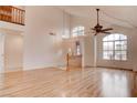 Bright living room with vaulted ceilings, light hardwood floors, and large windows providing ample natural light at 1584 Bermuda Dunes Dr, Boulder City, NV 89005