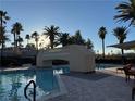 An inviting pool area with a bridge and comfortable seating, perfect for relaxation and socializing in the sun at 2050 W Warm Springs Rd # 4223, Henderson, NV 89014