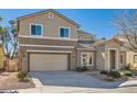 Charming two-story home featuring a well-manicured lawn and a spacious two car garage at 3925 Champagne Wood Dr, North Las Vegas, NV 89031