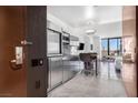 Modern kitchenette featuring stainless steel appliances and marble floors, offering a sleek and functional space at 4381 W Flamingo Rd # 2504, Las Vegas, NV 89103