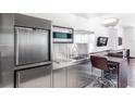 Modern kitchenette with stainless steel appliances and adjacent dining area, providing a convenient space for meals at 4381 W Flamingo Rd # 2504, Las Vegas, NV 89103